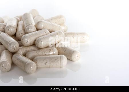 Front view of white multivitamin supplements isolated on white background. Stock Photo