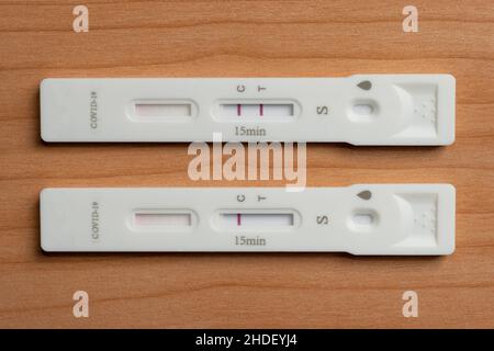 Two antigen rapid test devices for coronavirus covid-19 shows positive and negative result Stock Photo
