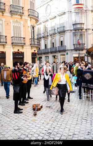 Tunas, traditional street music. Street scene, Malaga city, Andalusia, Spain Stock Photo