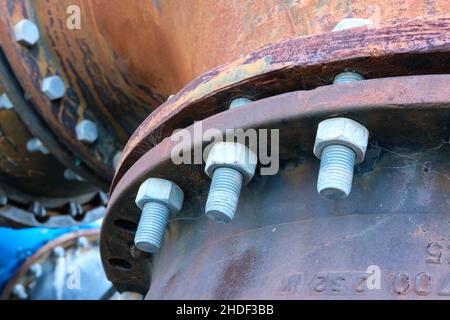 Close up of bolts holding a joint together on water treatment pipework. Stock Photo