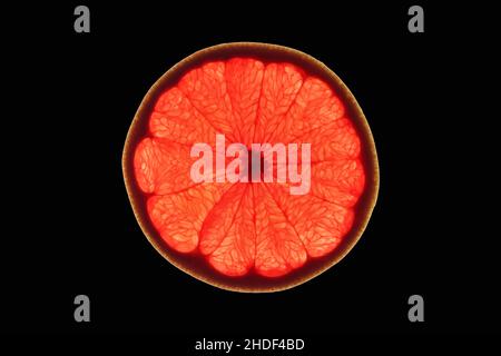 Slice of ripe ruby grapefruit on black background Stock Photo