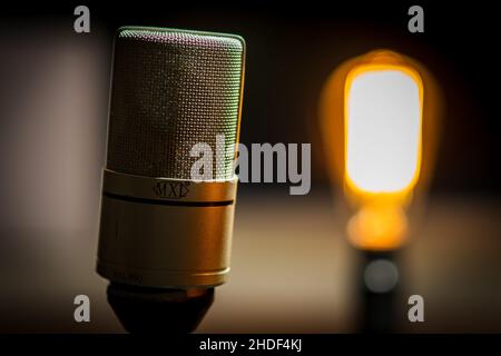 Shallow focus of a Studio microphone with blurred flash lamp Stock Photo