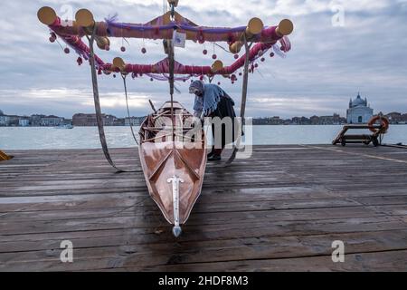 VENICE, ITALY - JANUARY 06: Befana brings the boat to be lowered into the water January 06, 2022 in Venice, Italy. In Italian folklore, the Befana is an old woman who delivers presents to children throughout Italy on the feast of the Epiphany on Jan. 6 in a similar way to St. Nicholas or Santa Claus: Stefano Mazzola/Awakening/Alamy Live News Stock Photo