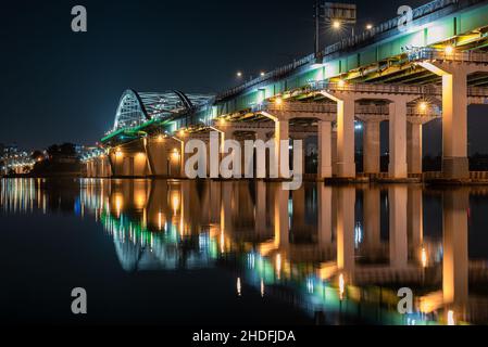 Yanghwa bridge reflection in the Han river at night in Seoul, South Korea Stock Photo