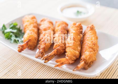 batter-fried prawns on dining table Stock Photo