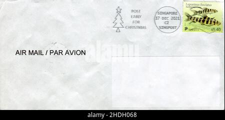 GOMEL, BELARUS - JANUARY 6, 2021: Old envelope which was dispatched from Singapore to Gomel, Belarus, December 17, 2021. Stock Photo