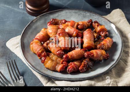Homemade Bacon Pigs in a Blanket Served as an Appetizer Stock Photo