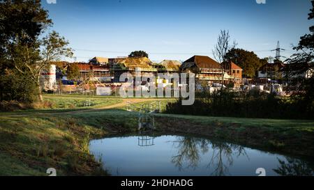 New homes built on green fields in Billingshurst, West Sussex, UK by Devine Homes Plc. Stock Photo