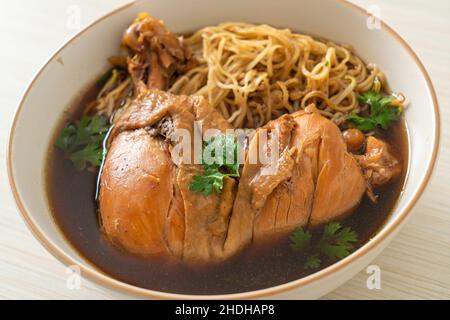 Noodles with Braised Chicken in Brown Soup Bowl - Asian food style Stock Photo