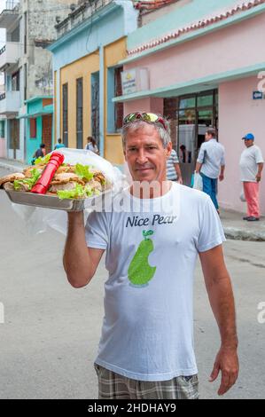 Portrait of a middle age self-employed Cuban man selling food items in the city streets. Jan. 6, 2022 Stock Photo