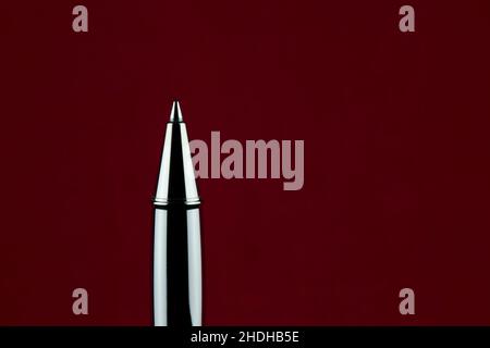 Upright roller ball pen isolated on a red background Stock Photo