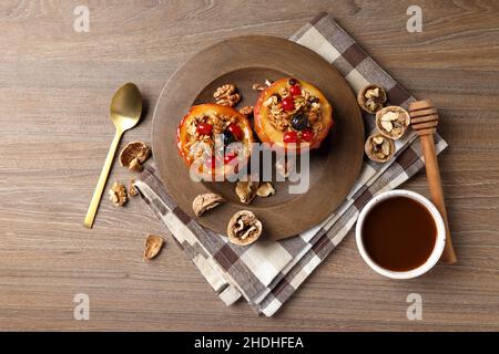 Concept of tasty food with baked apples on wooden background Stock Photo
