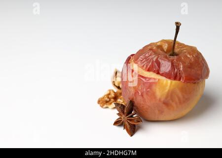 Concept of tasty food with baked apple on white background Stock Photo