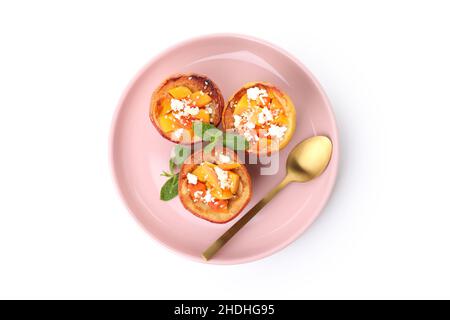 Plate with baked apples isolated on white background Stock Photo