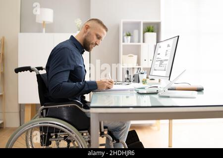 Accountant Using E Invoice Software At Computer In Office Stock Photo
