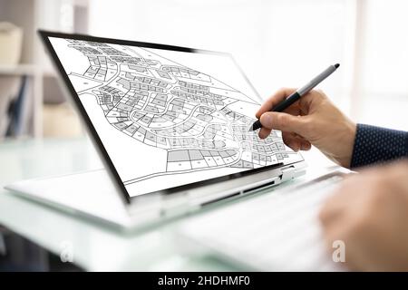 Male Executive Looking At Cadastre Map On Screen Stock Photo
