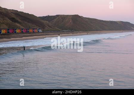 SALTBURN BY THE SEA, UK - 1 JANUARY 2020.  Surfers at Saltburn Beach at Sunrise on New Years Day 2020 Stock Photo