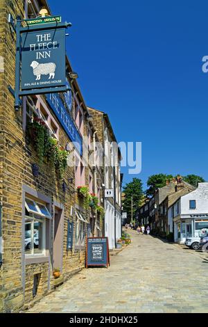 UK, West Yorkshire, Haworth, Main Street, The Fleece Inn and Cottages Stock Photo