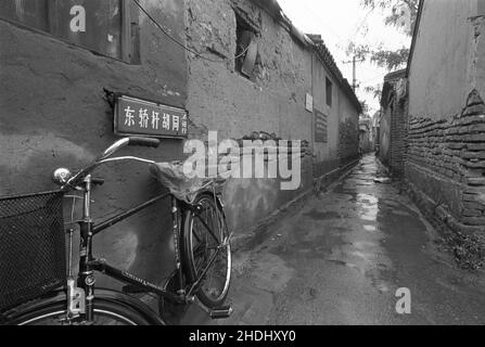 Bicycle parked in an old narrow Beijing hutong Stock Photo