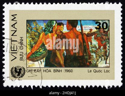 VIETNAM - CIRCA 1984: a stamp printed in Vietnam shows Woman and Soldiers, Painting, circa 1984 Stock Photo