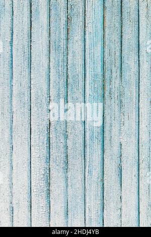 Light blue painted wooden planks vertical background, rough texture of old cracked paint Stock Photo