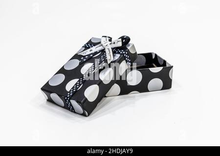 open gift box with a ribbon isolated on a white background Stock Photo