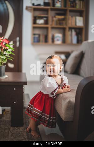 Cute little girl dressed in traditional Romanian folk costume Stock Photo