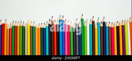 Colored pencils background. Color pencils on white background. Stock Photo
