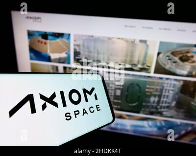 Mobile phone with logo of US aerospace company Axiom Space Inc. on screen in front of business website. Focus on center-right of phone display. Stock Photo