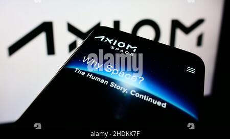 Smartphone with webpage of US aerospace company Axiom Space Inc. on screen in front of business logo. Focus on top-left of phone display. Stock Photo