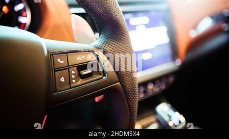 Close up steering wheel with multi function button. Luxury car interior Stock Photo