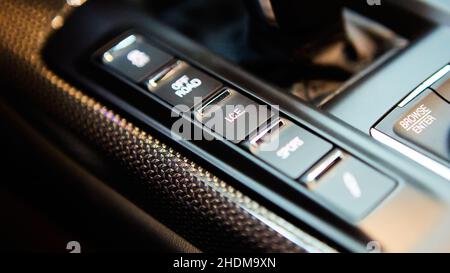 Automatic gear stick of a modern car, multimedia and navigation control buttons. Car interior details. Transmission shift. Shallow dof Stock Photo