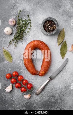 Smoked wurst, on gray stone table background, top view flat lay Stock Photo