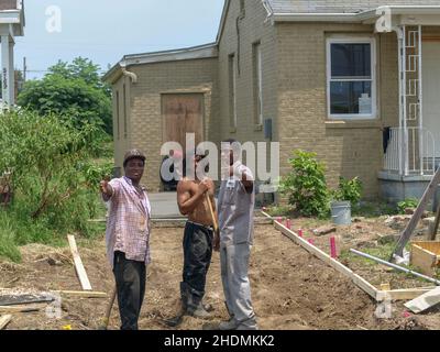 NEW ORLEANS, LA - JUNE 20, 2008: Workers discussing paving operation during construction project in Gentilly neighborhood Stock Photo