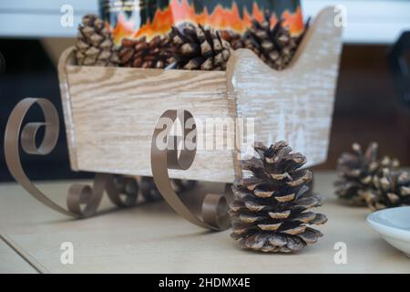 Close up shot of pine cone in wooden box and around Stock Photo