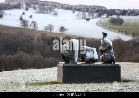 A heavy frost covers Henry Moore’s ‘Three Piece Reclining Figure No.1’ at the Yorkshire Sculpture Park as freezing temperatures replace the mild new year weather. Stock Photo