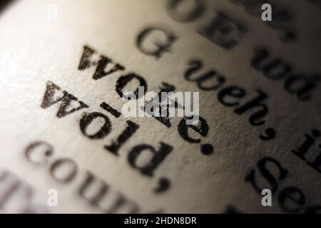 Word woke printed on dictionary page, macro close-up Stock Photo