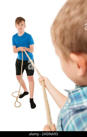 boy, siblings, power struggle, tug-of-war, boys, power struggles, tug-of-wars Stock Photo