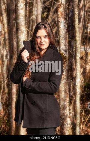 woman, forest, winter coat, female, ladies, lady, women, forests, wood, woodland, woods, coat, coats, winter coats Stock Photo