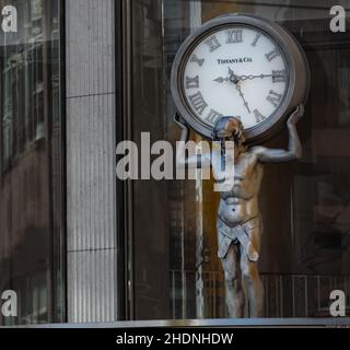 Vancouver BC, Canada. September 29,2020. Atlas man fugure holding clock above Tiffany Store and Co. in downtown in Vancouver. Selective focus, close u Stock Photo