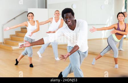 Group of multinational people practicing dance techniques Stock Photo