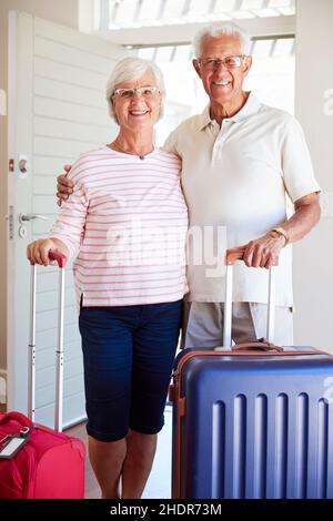 vacations, rolling suitcase, older couple, holiday, vacation, rolling suitcases, older couples Stock Photo