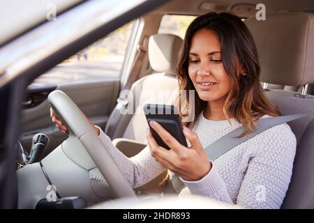using, car trip, smart phone, car journey, car ride, drive, driving, road trip, road trips, smart phones, smartphone, smartphones Stock Photo