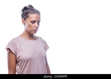 A sad adult woman looking down on a white background Stock Photo