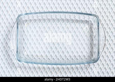 A baking dish cleaned from a thick layer of carbon. Glassware for baking after washing with a steam cleaner. Stock Photo