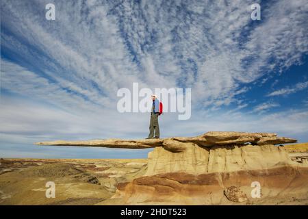 Tourist on King of Wing, amazing rock formations in Ah-shi-sle-pah wilderness study area, New Mexico USA Stock Photo