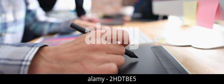Two graphic designers working in office closeup Stock Photo