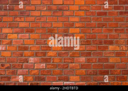 Red brick wall texture grunge background with regular pattern. Stock Photo