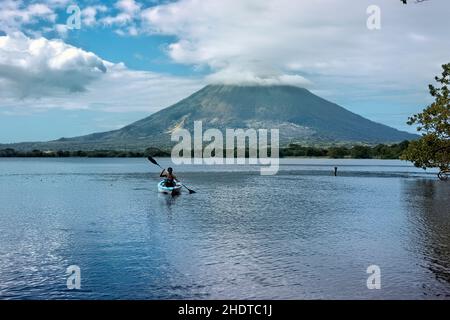 Kayaking under Concepcion Volcano on Lake Nicaragua, Ometepe Island, Nicaragua Stock Photo