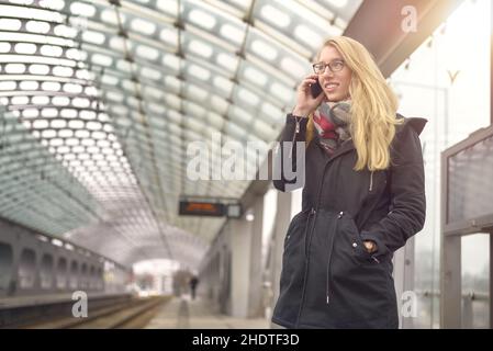 young woman, railroad station, public transport, girl, girls, woman, young women, railroad stations, public transports Stock Photo